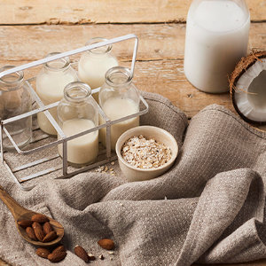 Image of oats and milk in glass bottles